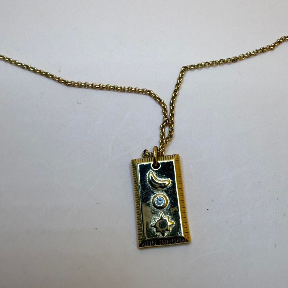 Gold tone 925 necklace with rectangular pendant featuring moon & star